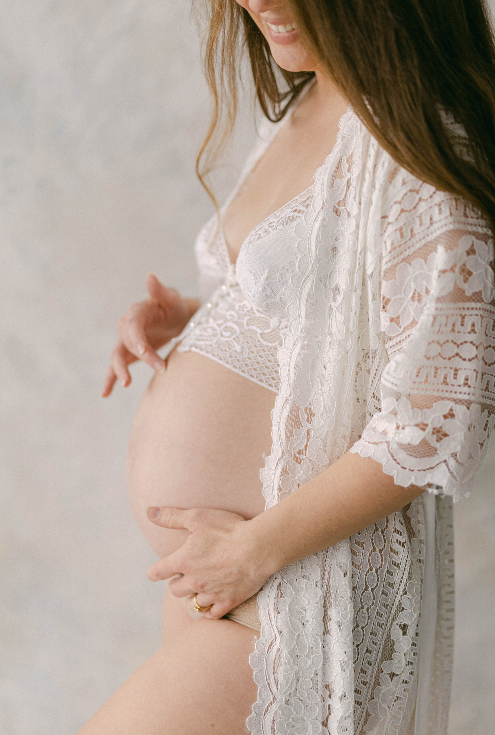 knoxville baby photographer women in lace robe touching pregnant belly