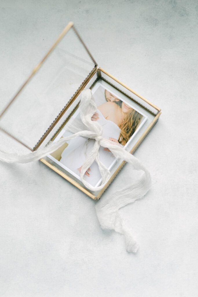 knoxville newborn photographer. heirloom glass box with family prints 